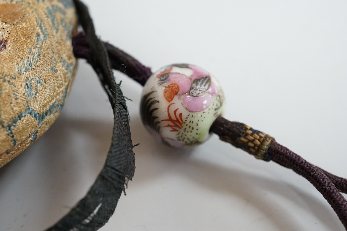 A Chinese embroidered spectacles case and an armorial oval miniature dish